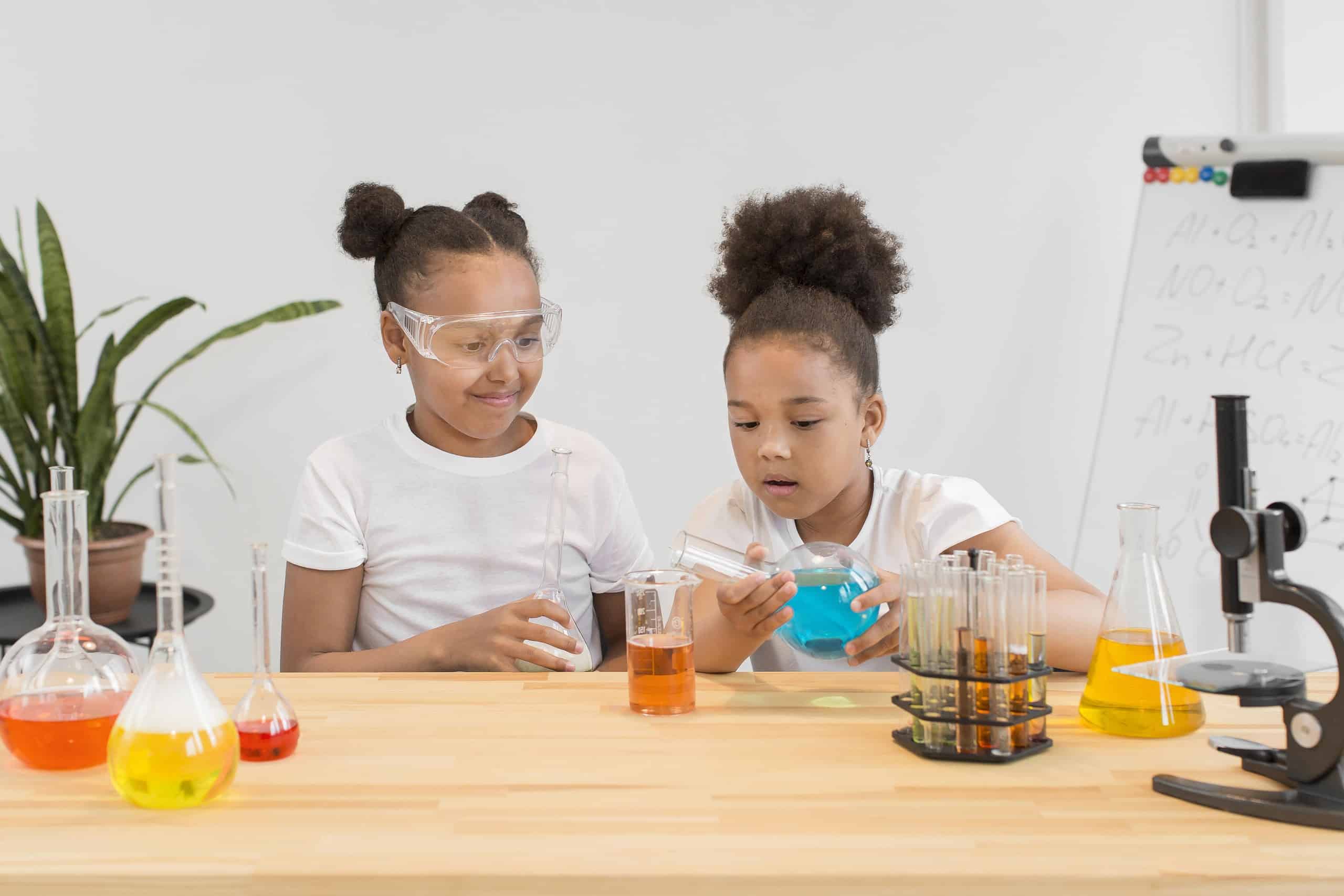front-view-girls-experimenting-chemistry-home